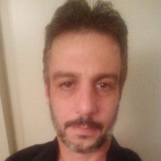 Michael West Dark-haired man with a mustache and a salt-and-pepper beard